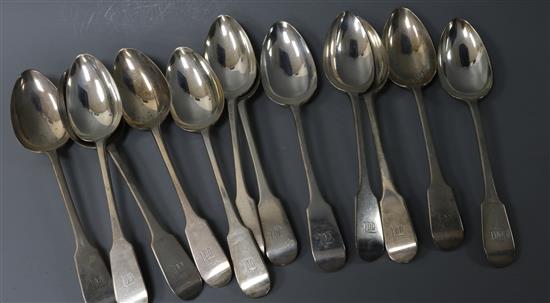 A set of twelve George V silver fiddle pattern table spoons, C.W Fletcher & Sons Ltd, 25 oz.